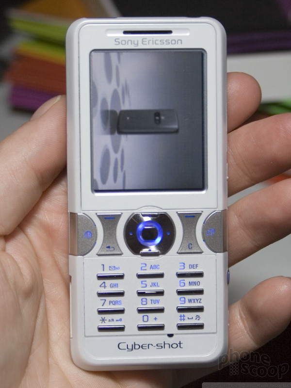 A model holds the new Sony Ericsson W880i mobile phone at the